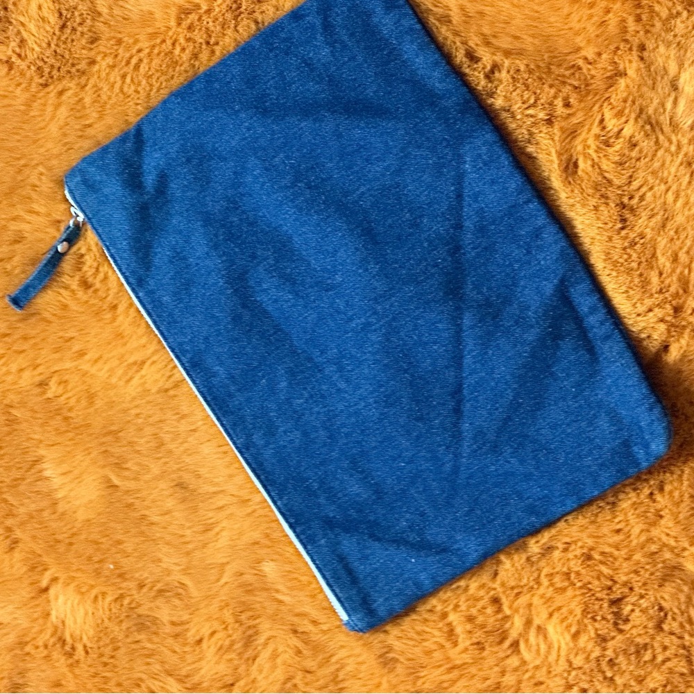 Blue denim clutch . USED